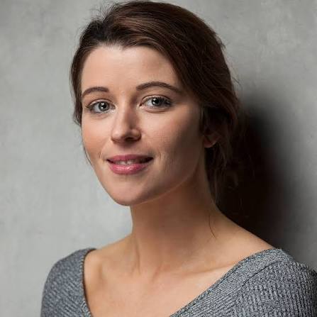 A woman smiling at the camera